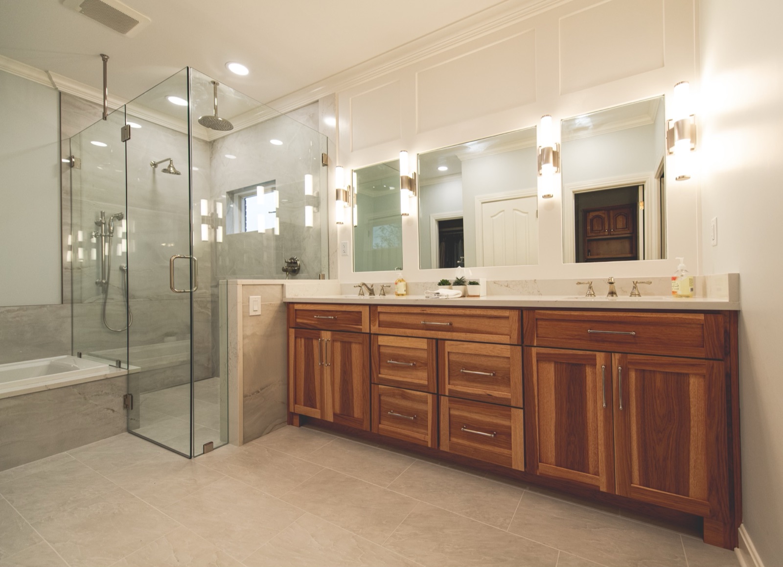 Bathroom with walnut vanity and chrome hardware