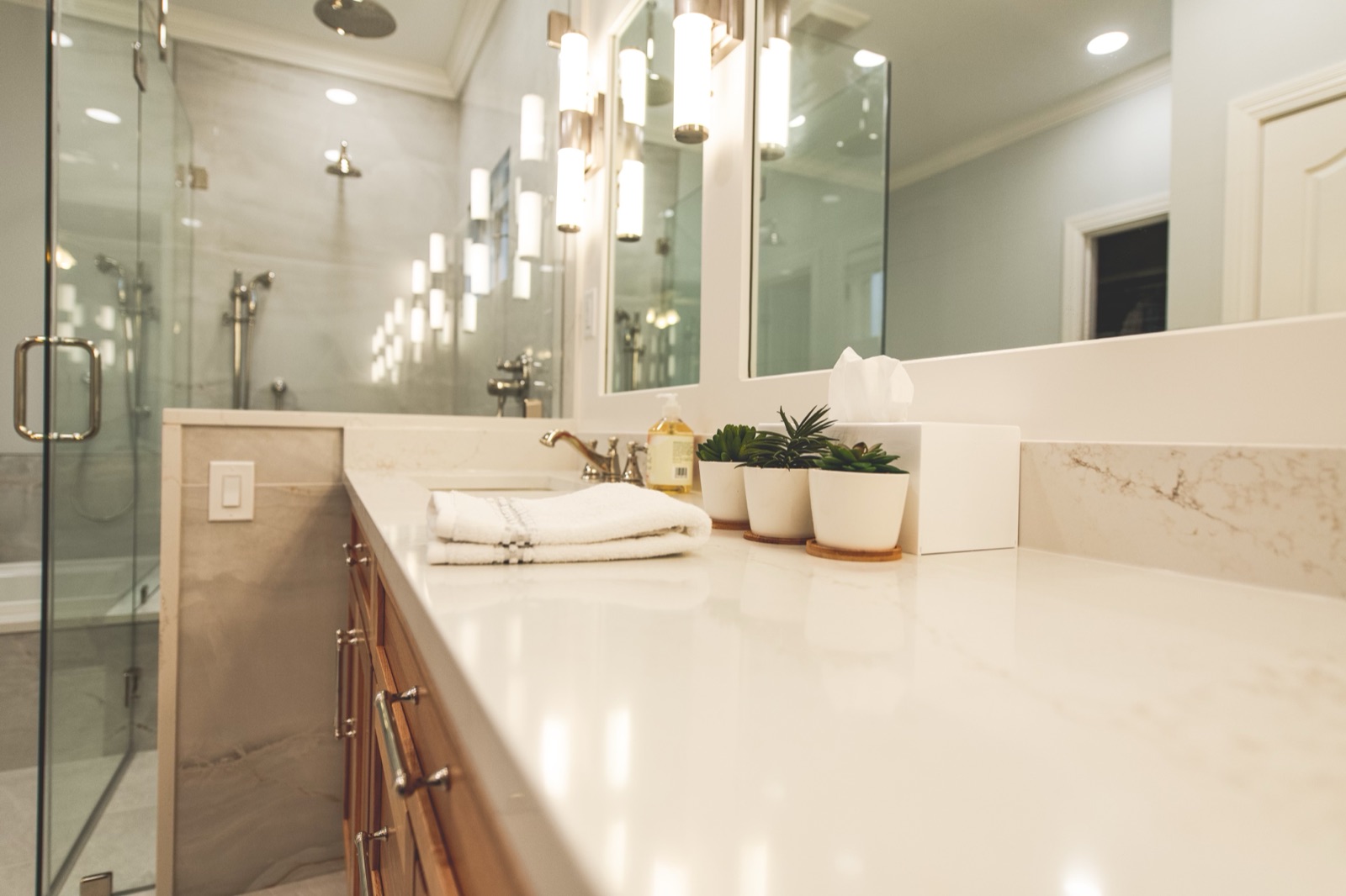 Primary bath vanity with quartz countertop and undermount sinks