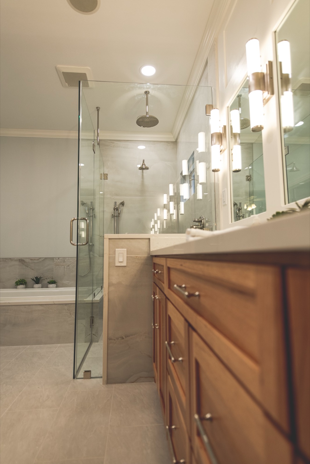 Freestanding tub with floor-mounted filler and tile surround